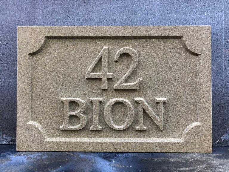 Stone house name and number plaques and hand carved sandstone signs