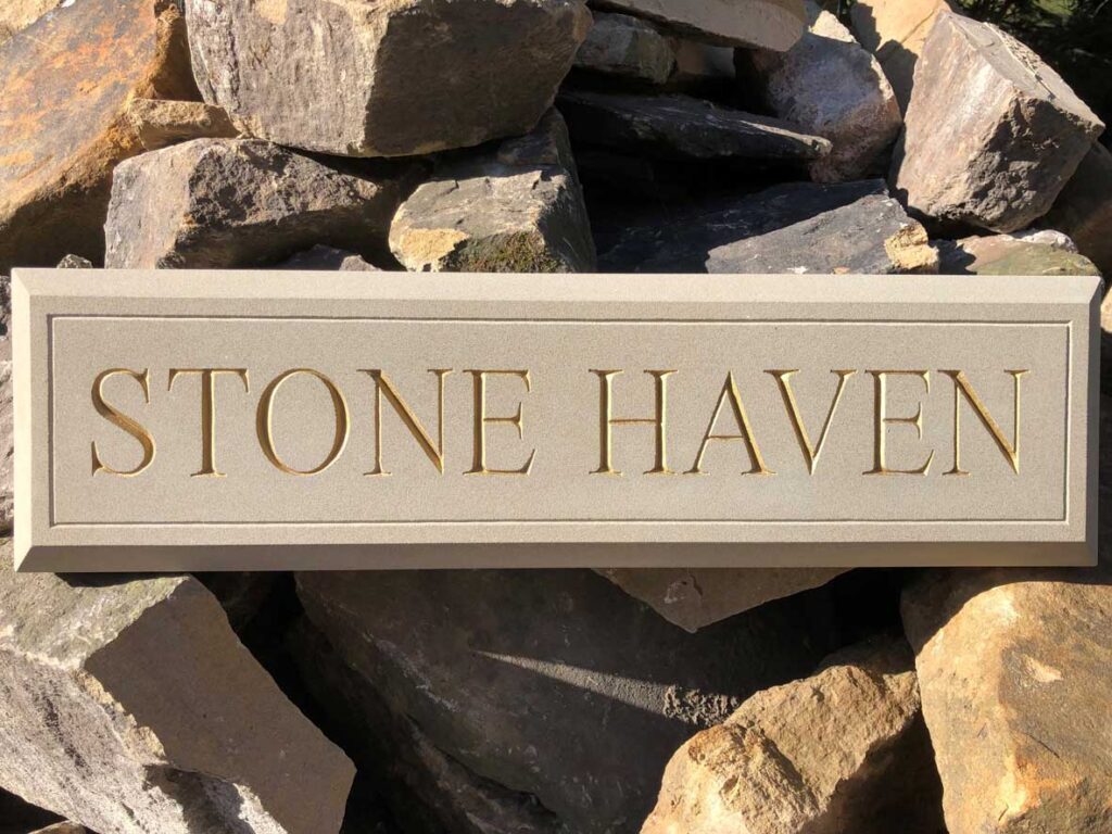 Stone house name and number plaques and hand carved sandstone signs